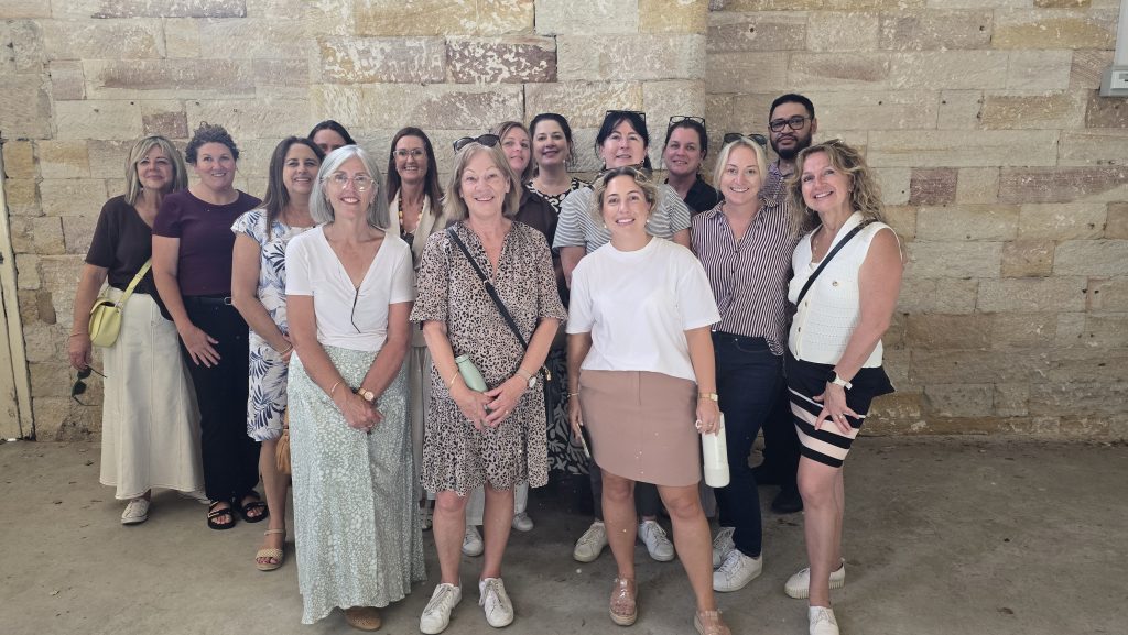 A work group taking a tour of the Parramatta Female Factory as part of professional development